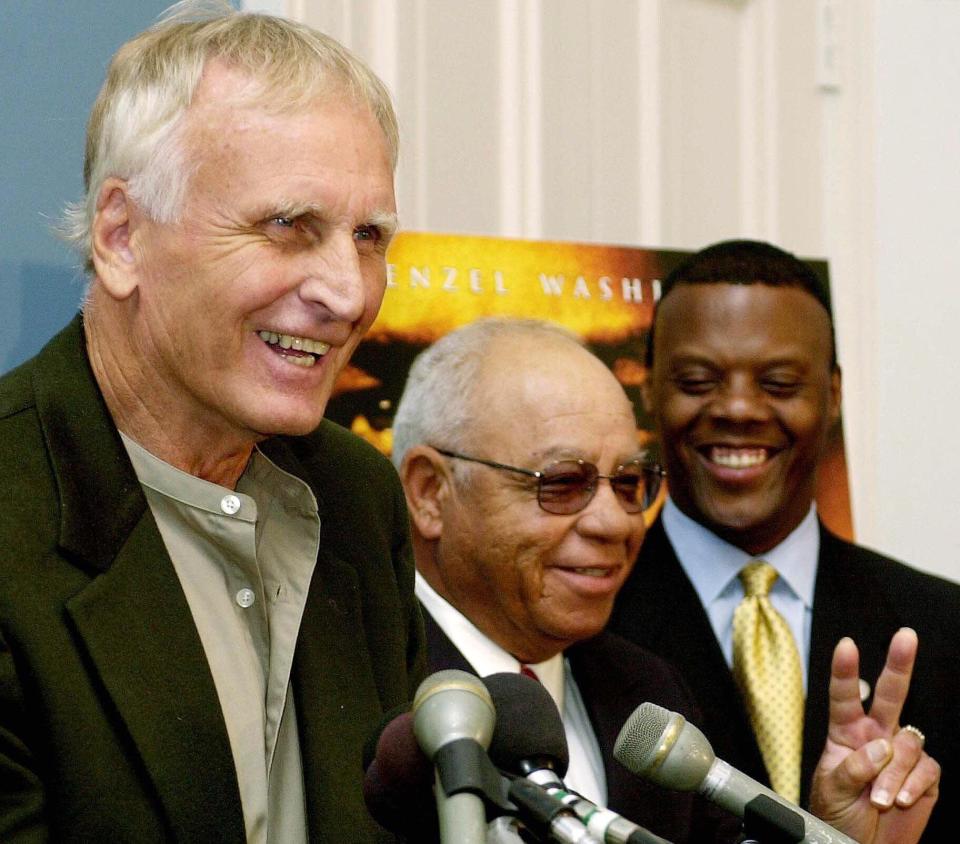 WASHINGTON, :  US Rep. J.C, Watts, Jr (R-OK) (R) looks on as former Alexandria, Virginia high school foootball coaches Bill Yoast (L) and Herman Boone (C) discuss the Walt Disney Company's latest film "Remember the Titans" 26 September 2000 during a press conference at the US Capitol building in Washington DC.  Yoast and Boone are the coaches portrayed in the film. AFP PHOTO/Joyce NALTCHAYAN (Photo credit should read JOYCE NALTCHAYAN/AFP/Getty Images)