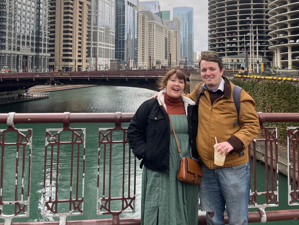 alexis and her partner posing for a photo on a bridge in chicago