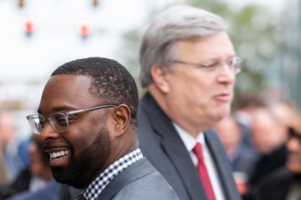 Memphis Mayor-elect Paul Young and Memphis Mayor Jim Strickland stand next to each other while speaking to other attendees prior to the ceremonial groundbreaking for 100 N. Main redevelopment in Downtown Memphis on Thursday, November 30, 2023.