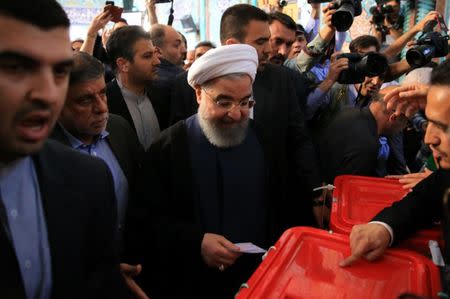 Iranian President Hassan Rouhani casts his vote during the presidential election in Tehran, Iran, May 19, 2017. TIMA via REUTERS