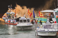 Fishing vessels at sea off the coast of Jersey, Thursday, May 6, 2021. French fishermen angry over loss of access to waters off their coast have gathered their boats in protest off the English Channel island of Jersey. The head of a grouping of Normandy fishermen said about 50 boats from French ports joined the protest Thursday morning and gathered their fleet off the Jersey port of St. Helier. (Oliver Pinel via AP)