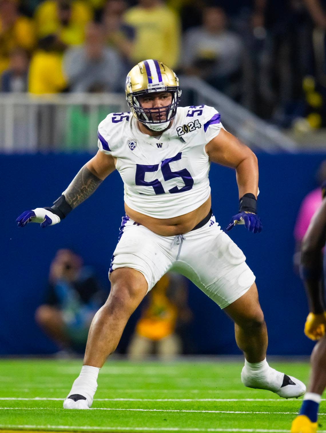 Jan 8, 2024; Houston, TX, USA; Washington Huskies offensive lineman Troy Fautanu (55) against the Michigan Wolverines during the 2024 College Football Playoff national championship game at NRG Stadium. Mandatory Credit: Mark J. Rebilas-USA TODAY Sports Mark J. Rebilas/Mark J. Rebilas-USA TODAY Sports