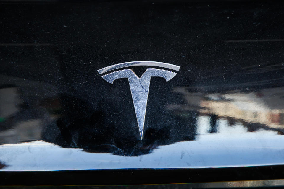 A Tesla car uses an electric vehicle charging station in London. (Photo by Dinendra Haria / SOPA Images/Sipa USA)