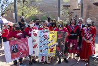 In this image provided by the Navajo Nation Office of the Speaker, advocates and family members pose, Wednesday, May 5, 2021, in Window Rock, Ariz., during an event to commemorate a day of awareness for the crisis of violence against Indigenous women and children. (Byron C. Shorty, Navajo Nation Office of the Speaker via AP)