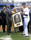 New York Yankees' Derek Jeter, right, presents a photo of a Nelson Madela plaque to, from left, Lindo Mandela, Zondwa Mandela, Rachel Robinson and Sharon Robinson before Game 2 of an interleague baseball doubleheader against the Chicago Cubs, Wednesday, April 16, 2014, at Yankee Stadium in New York. Lindo is the wife of Zondwa, Zondwa is the grandson of Nelson, Rachel is the widow of baseball great Jackie Robinson and Sharon is the daughter of Rachel and Jackie. (AP Photo/Bill Kostroun)