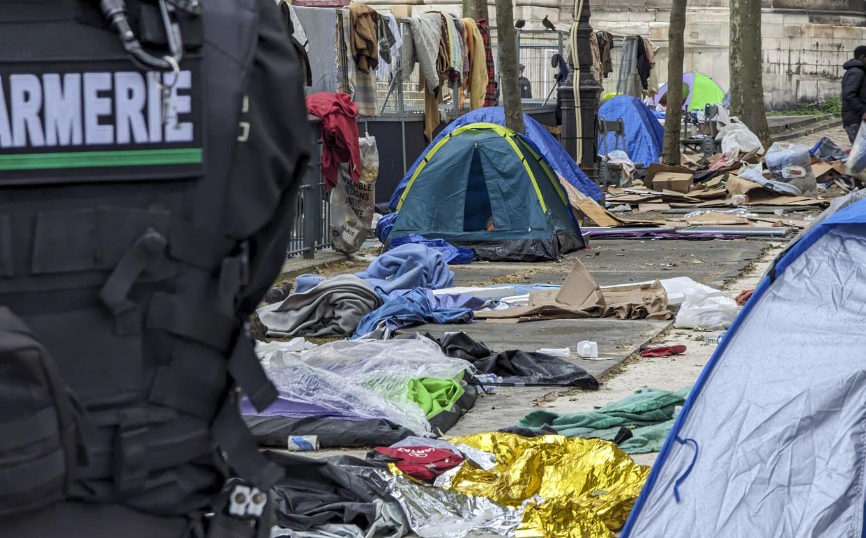 Police clear a migrant camp located near the Paris city hall