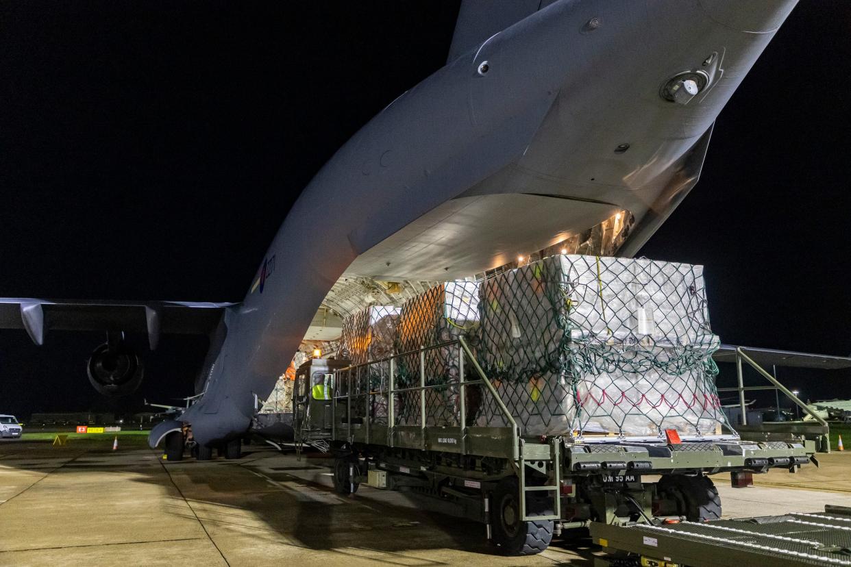 A Royal Air Force C-17 aircraft is loaded with 21 tonnes of aid headed for Gaza (EPA)