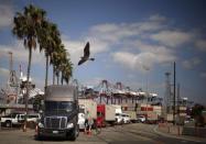 Trucks line up at the Port of Long Beach, in Long Beach, California October 15, 2014. REUTERS/Lucy Nicholson