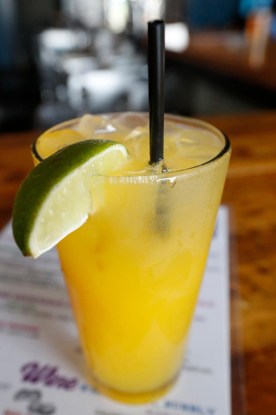 Normal Bar's new spring mocktail the Mellow Yellow with mango, lime and CBD seltzer.