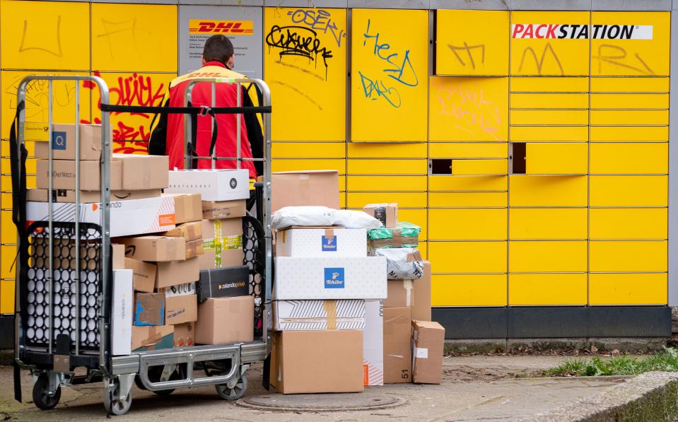 19 March 2020, Berlin: Numerous packages are delivered to a DHL packing station in the Berlin district of Friedenau. In order to slow down the spread of the corona virus, the German government has considerably restricted public life. After the closure of numerous shops, the online mail order business continues. Photo: Kay Nietfeld/dpa (Photo by Kay Nietfeld/picture alliance via Getty Images)