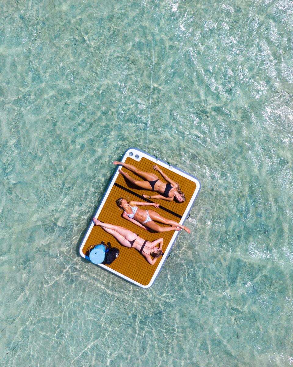 Models on inflatable pontoon