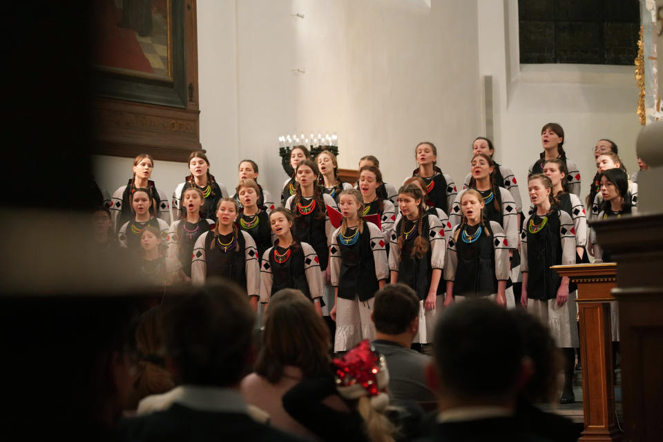 Members of the Shchedryk youth choir perform during a Christmas concert at Copenhagen’s Church of the Holy Spirit, in Copenhagen, Denmark, Thursday, Dec. 8 2022. The Shchedryk ensemble, described as Kyiv’s oldest professional children’s choir, were in the Danish capital this week for a performance as part of an international tour that also took them to New York’s famed Carnegie Hall. (AP Photo/James Brooks)