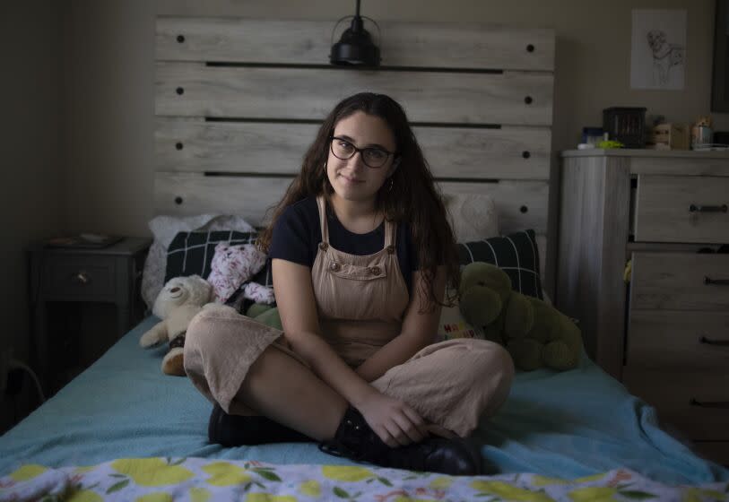 SANTA CLARITA, CA - November 22, 2022 - Gun control activist Mia Tretta, who was shot during a mass shooting at Saugus High in 2019, sits for portraits at her home on Tuesday, Nov. 22, 2022 in Santa Clarita, CA. (Brian van der Brug / Los Angeles Times)