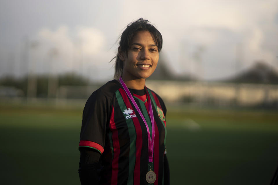 Ghizlane Chebbak, Morocco's women national team's captain and player of ASFAR poses for a portrait with her medal after leading her team to winning the women's soccer league, in Rabat, Morocco, Sunday, May 21, 2023. (AP Photo/Mosa'ab Elshamy)