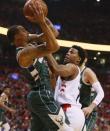 May 21, 2019; Toronto, Ontario, CAN; Milwaukee Bucks guard George Hill (3) controls the ball as Toronto Raptors guard Kyle Lowry (7) defends during the first half in game four of the Eastern conference finals of the 2019 NBA Playoffs at Scotiabank Arena. Mandatory Credit: John E. Sokolowski-USA TODAY Sports