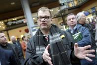 Juha Sipilä, chairman of the Centre Party, campaigns in Espoo, Finland on April 18, 2015 ahead of the parliamentary elections to take place on Sunday, April 19, 2015