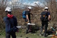 Members of the Canadian Burnaby Firefighters Search & Rescue Task Force search for victims after Hurricane Dorian hit the Abaco Islands in Marsh Harbour