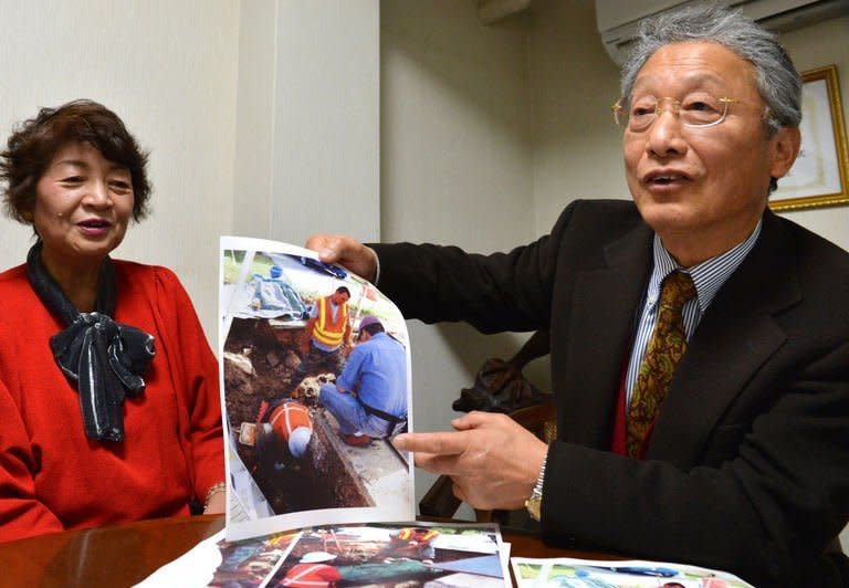 Heitaro Matsumoto (R) and Sumiko Naito, whom are part of a voluntary programme to repatriate fallen Japanese soldiers, are pictured in Tokyo on February 5, 2013. Nearly seven decades after hostilities ended in 1945, Japan is still trying to collect remains in an effort seen as a symbolic gesture honouring those who paid the ultimate sacrifice
