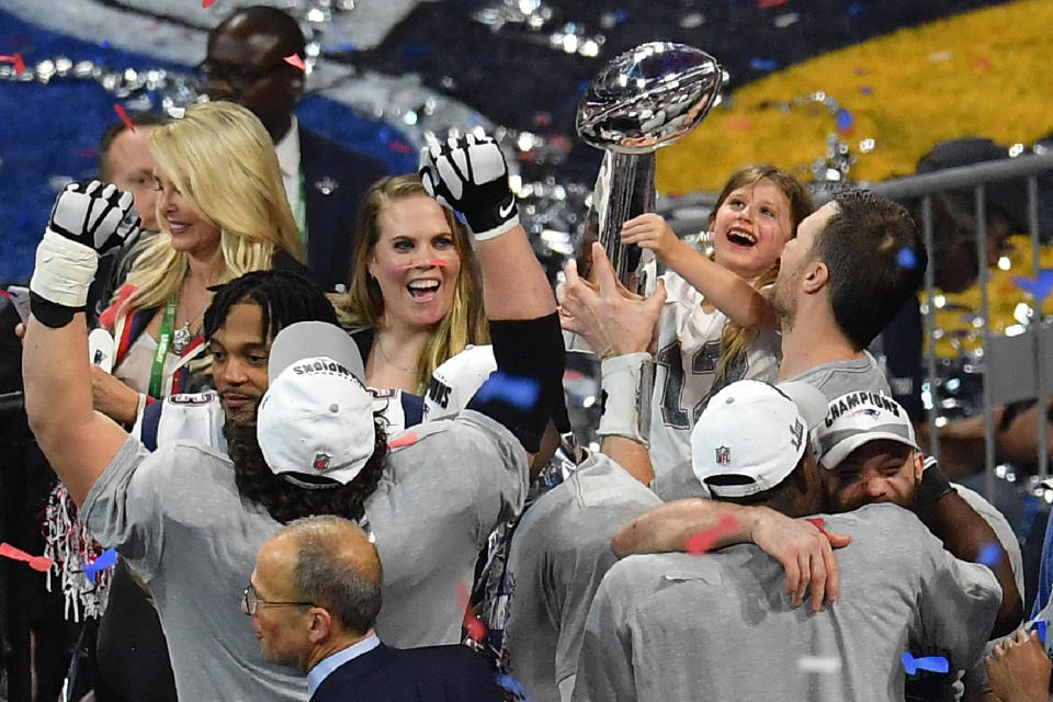 <p>Quarterback for the New England Patriots Tom Brady (R) his daughter Vivian Lake Brady and teammates celebrate after winning Super Bowl LIII against the Los Angeles Rams at Mercedes-Benz Stadium in Atlanta, Georgia, on February 3, 2019. (Photo by Angela Weiss / AFP) </p>