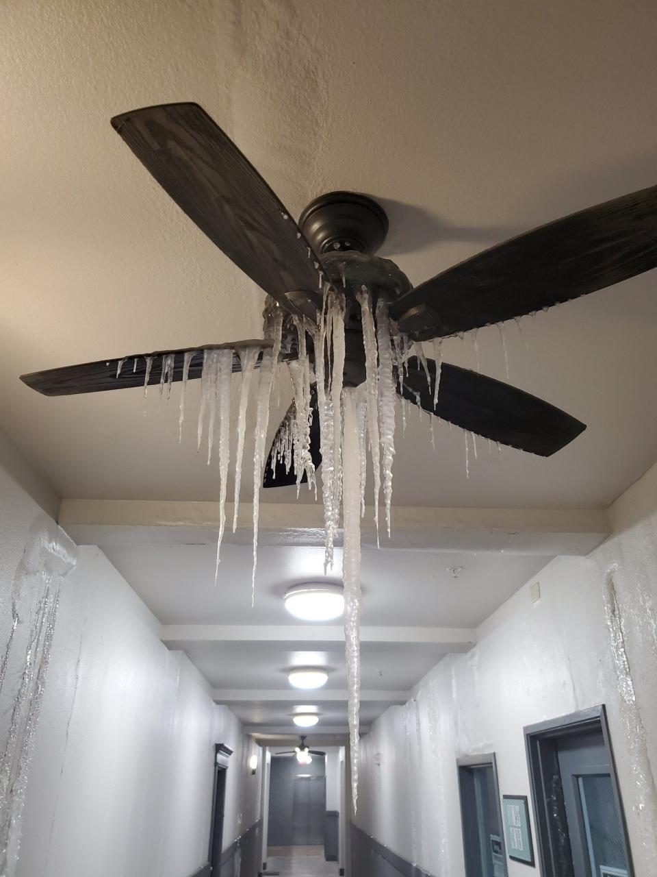 Icicles hang from a ceiling fan in Dallas, Texas, amid a historic cold snap in February.