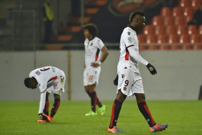 Nice's Mario Balotelli (R) leaves the field after receiving a red card during their Ligue 1 match against Lorient on February 18, 2017