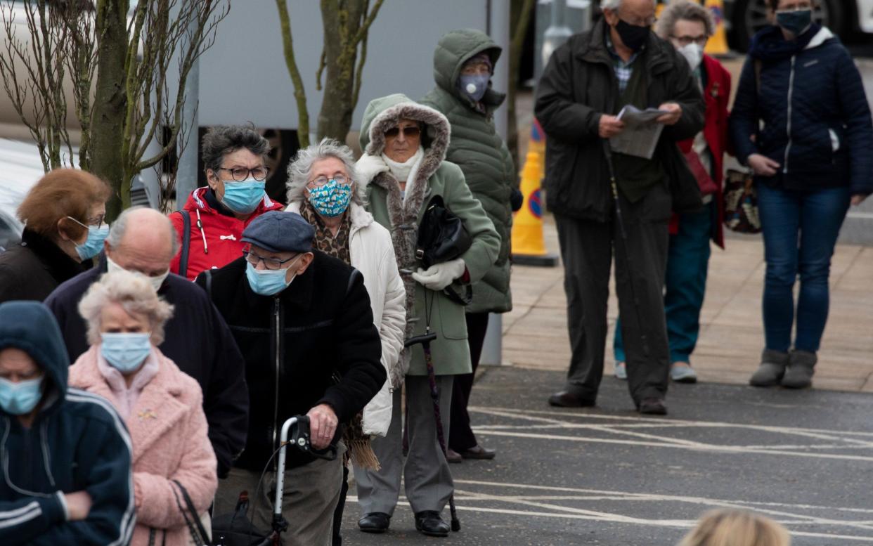 People queueing to receive their Covid vaccines in Epsom, Surrey, as the rollout began at the start of this year - Dan Kitwood/Getty Images Europe