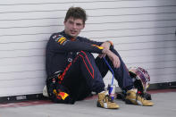 Red Bull driver Max Verstappen of the Netherlands rests against a garage wall after winning the Formula One Miami Grand Prix auto race at the Miami International Autodrome, Sunday, May 8, 2022, in Miami Gardens, Fla. (AP Photo/Darron Cummings)