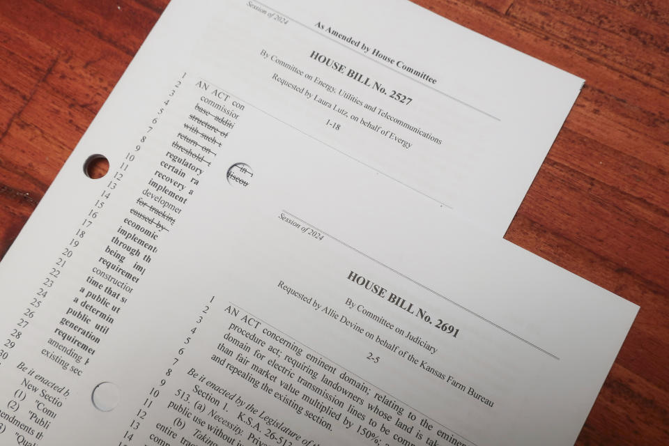 Two of the dozens of Kansas House bills that now list the names of groups and lobbyists who asked lawmakers or committees to introduce them, are seen Monday, March 25, 2024, at the Statehouse in Topeka, Kan. The House started adding the information to bills this year as a way to make it easier for people to find out who was behind what proposals. (AP Photo/John Hanna)