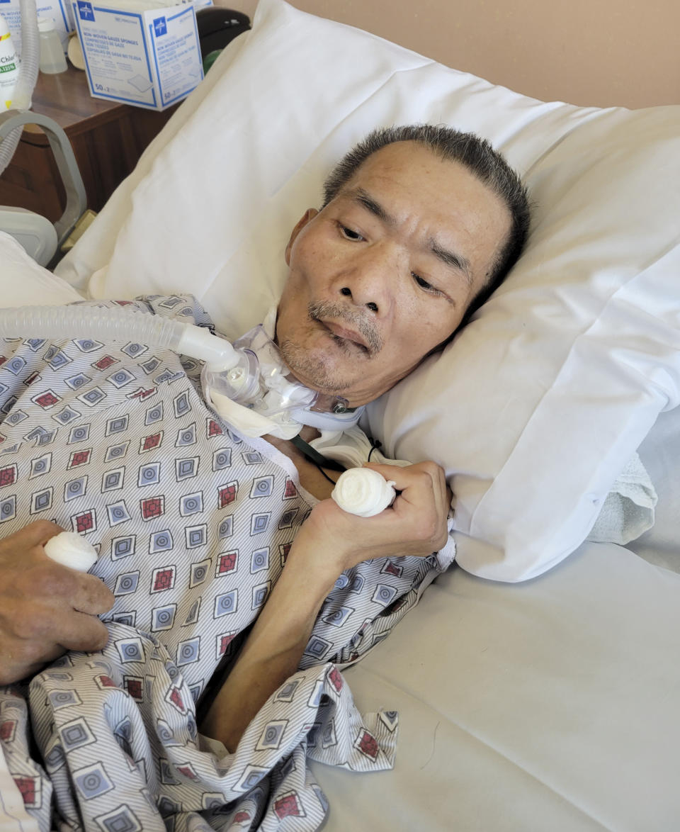 In this Wednesday, Oct. 27, 2021, photo provided by Karlin Chan, Chinese immigrant Yao Pan Ma is shown hospitalized after he was attacked in April while collecting cans in the East Harlem neighborhood of New York. Ma died Dec. 31 and his attacker, forty-nine-year-old Jarrod Powell who was previously charged with attempted murder, felony assault and hate crimes charges, now faces a homicide charge. (Karlin Chan via AP)