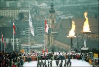 <p>To signify their second Olympic Games, organizers in Innsbruck decided to light two flames during the opening ceremony. The event was held above a dramatic backdrop of the city. Fun fact: A specially designed car with a glass dome allowed passersby to catch a glimpse of the Olympic torch as it made its way across a 932-mile leg of the relay. </p>