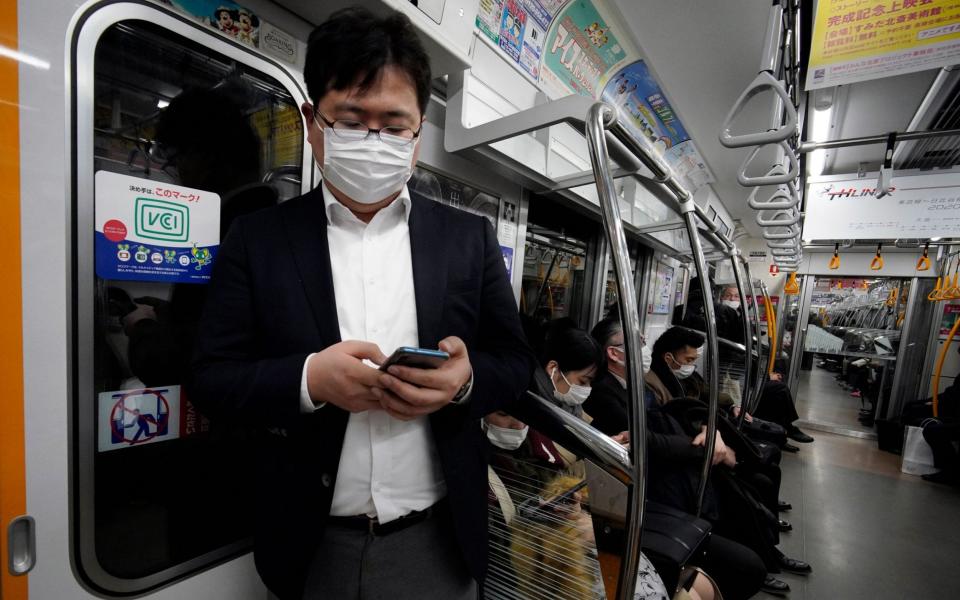 Japan has been criticised for its lack of quarantine time for returning passengers - FRANCK ROBICHON/REX 