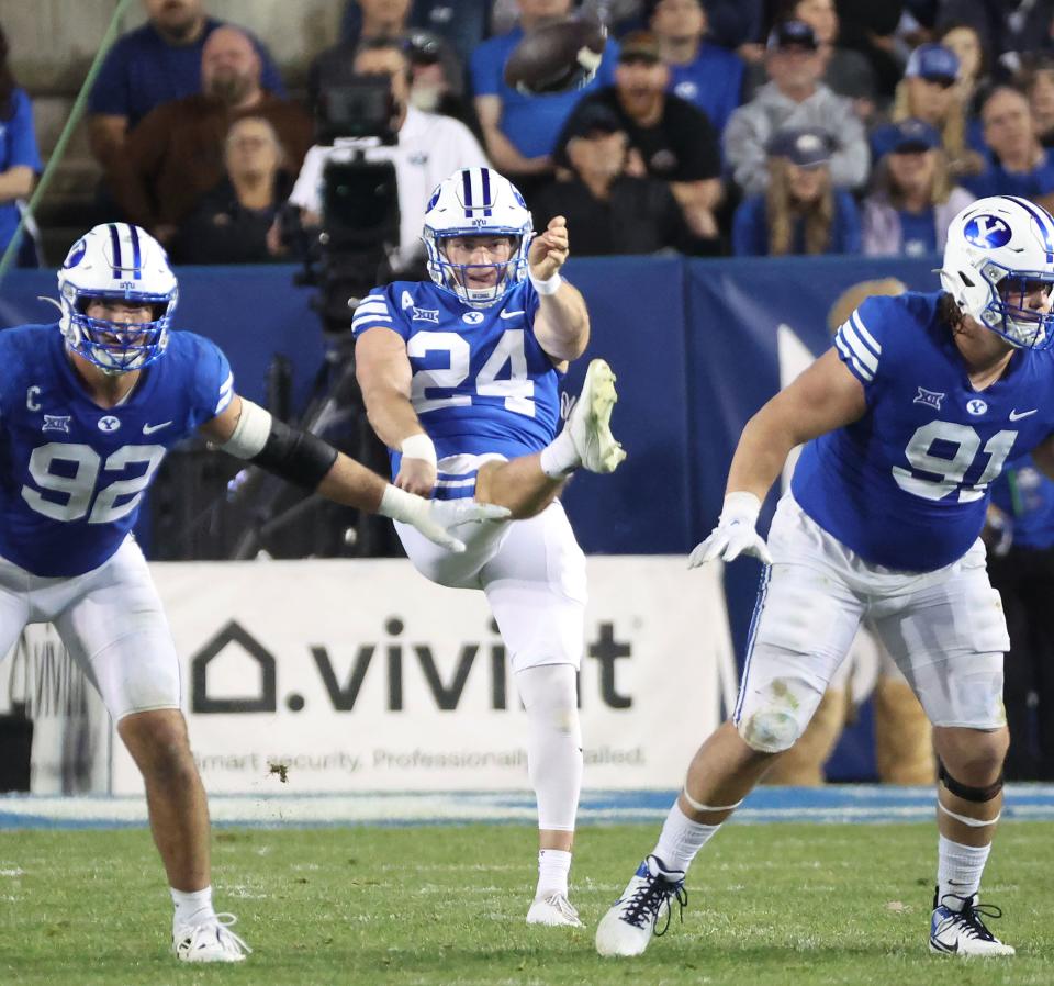 Brigham Young Cougars punter Ryan Rehkow (24) punts against the Texas Tech Red Raiders in Provo on Saturday, Oct. 21, 2023. BYU won 27-14. | Jeffrey D. Allred, Deseret News