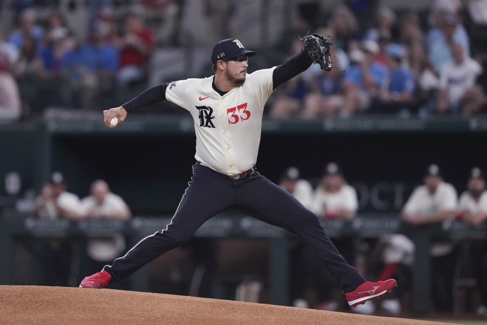 Texas Rangers starting pitcher Dane Dunning throws to a Seattle Mariners batter during the first inning of a baseball game in Arlington, Texas, Friday, Sept. 22, 2023. (AP Photo/LM Otero)