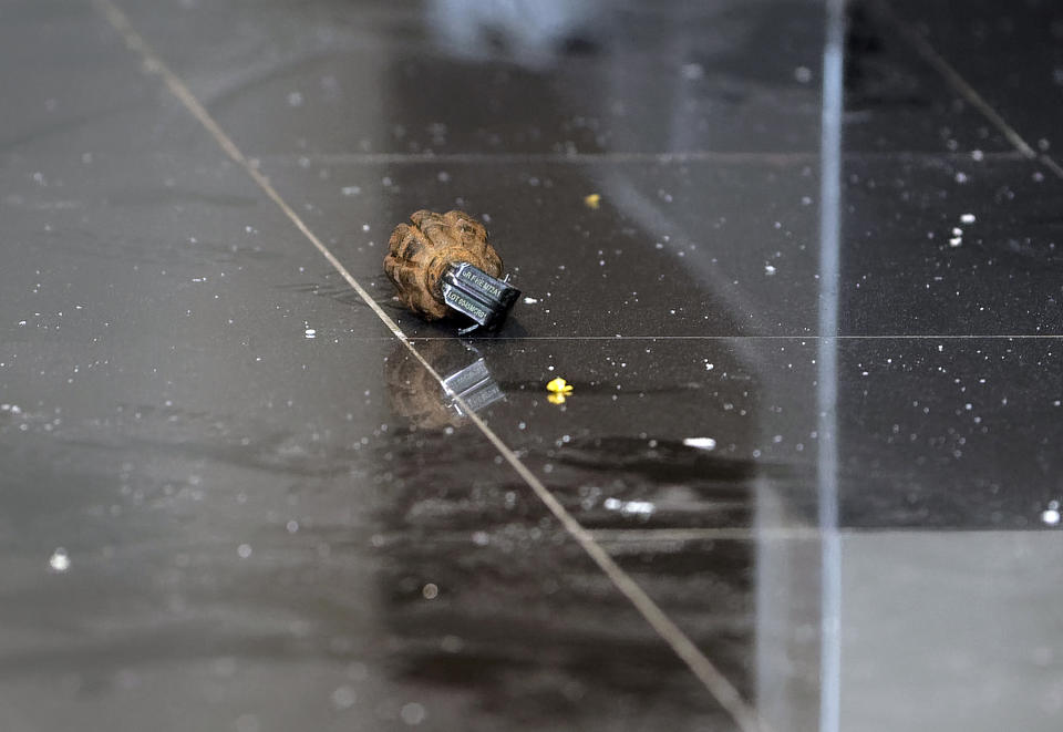An unexploded grenade lies in a hallway in a hotel complex in Nairobi, Kenya, Jan. 15, 2019. (Photo: Ben Curtis/AP)