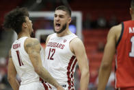 Washington State forwards DJ Rodman (11) and Mael Hamon-Crespin (12) celebrate a Utah turnover during the second half of an NCAA college basketball game, Sunday, Dec. 4, 2022, in Pullman, Wash. Utah won 67-65. (AP Photo/Young Kwak)