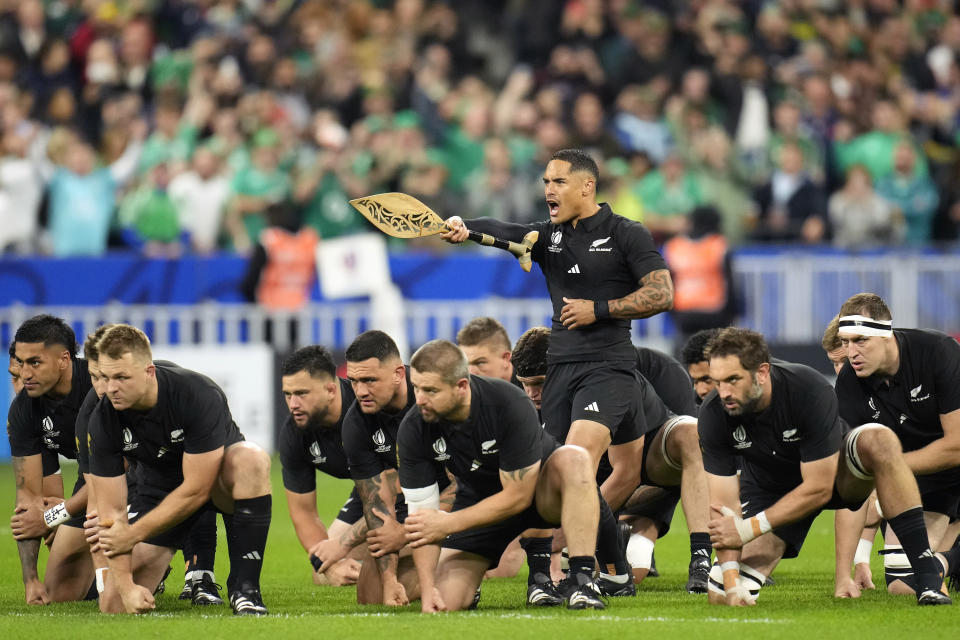 New Zealand's Aaron Smith leads the team as they perform the Haka just prior to the start of the Rugby World Cup quarterfinal match between Ireland and New Zealand at the Stade de France in Saint-Denis, near Paris Saturday, Oct. 14, 2023. (AP Photo/Christophe Ena)