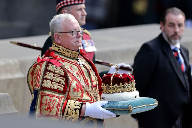 <p>Chris Jackson - WPA Pool/Getty Images</p> The crown of King James V of Scotland is carried into St Giles' Cathedral on July 5.