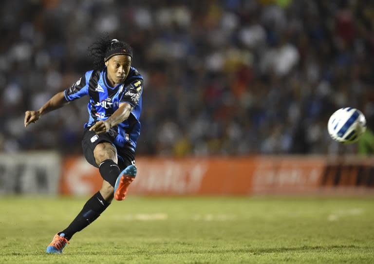 Queretaro's Ronaldinho kicks the ball during their Apertura Mexican tournament match against Toluca at the Corregidora stadium on September 26, 2014