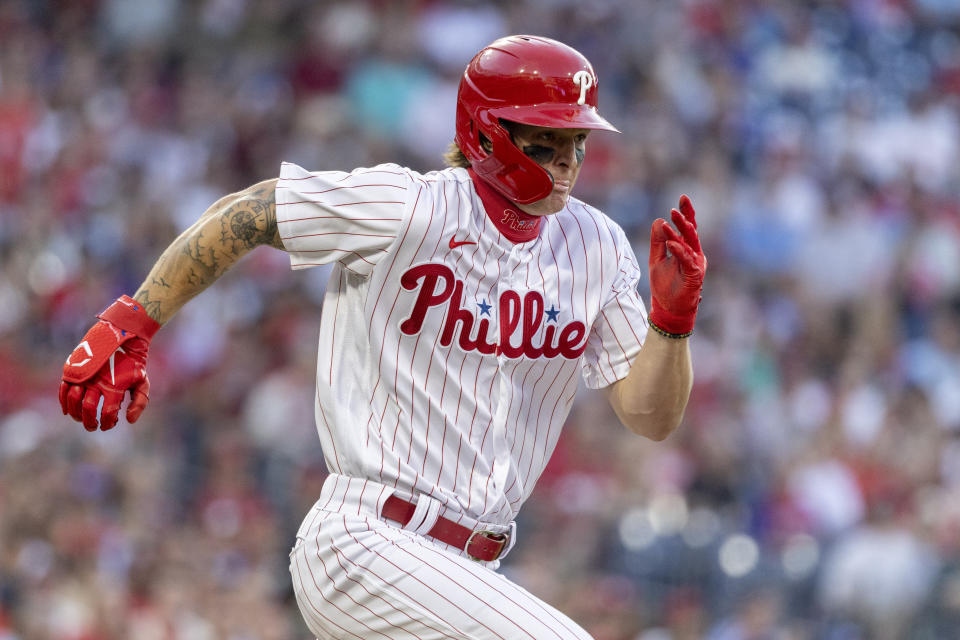 Philadelphia Phillies' Mickey Moniak runs to first after hitting an RBI singe during the first inning of a baseball game against the Los Angeles Angels on Saturday, June 4, 2022, in Philadelphia. (AP Photo/Laurence Kesterson)