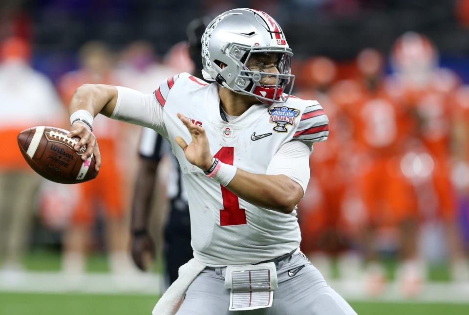 Ohio State Buckeyes quarterback Justin Fields (1) attempts a pass against the Clemson Tigers during the first half at Mercedes-Benz Superdome.