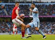 Manchester City's Aleksandar Kolarov (R) kicks the ball towards the arm of Middlesbrough's Daniel Ayala before appealing for hand ball during their English FA Cup 4th round soccer match at the Etihad Stadium in Manchester, northern England, January 24, 2015. REUTERS/Darren Staples (BRITAIN - Tags: SPORT SOCCER)