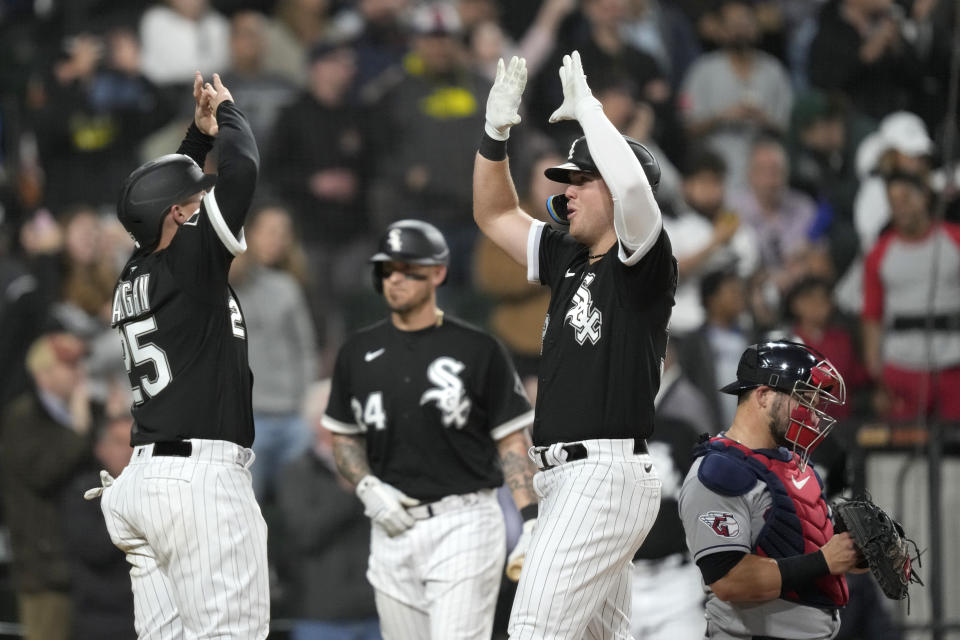Chicago White Sox's Gavin Sheets celebrates his three-run home run off Cleveland Guardians starting pitcher Shane Bieber with Andrew Vaughn during the fifth inning of a baseball game Tuesday, May 16, 2023, in Chicago. (AP Photo/Charles Rex Arbogast)