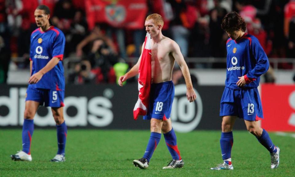 Rio Ferdinand, Paul Scholes and Ji-sung Park trudge off the pitch having been eliminated from the Champions League after losing to Benfica in the group stage in 2005.