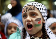<p>A girl with a Palestinian flag and Arabic that read “Jerusalem is for us” painted on her face chants slogans during a sit-in in the Bourj al-Barajneh Palestinian refugee camp in Beirut, Lebanon, Wednesday, Dec. 6, 2017. (Photo: Bilal Hussein/AP) </p>