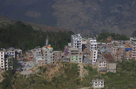 An aerial view of collapsed and damaged houses is seen blocking a street after the earthquake at Charikot in Dolkha district, Nepal May 14, 2015. REUTERS/Navesh Chitrakar