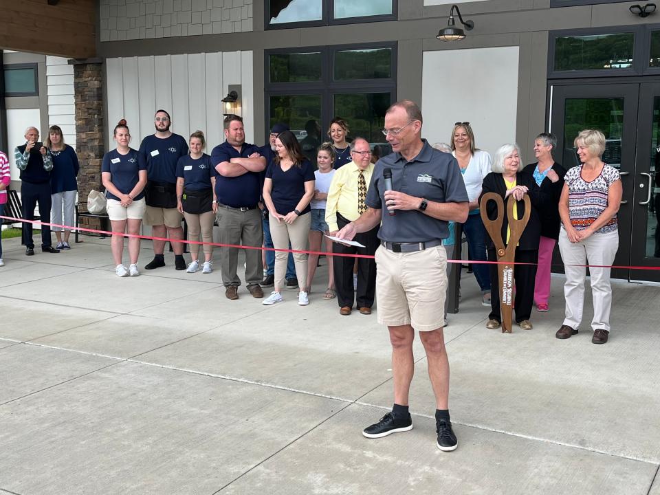 Craig Butler, executive director of the Muskingum Watershed Conservancy District, speaks at a ribbon-cutting ceremony Friday for the newly renovated Tappan Lake Marina.