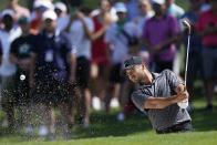 Jason Day, of Australia, hits from a bunker on the first hole during the third round of the Byron Nelson golf tournament in McKinney, Texas, Saturday, May 13, 2023. (AP Photo/LM Otero)