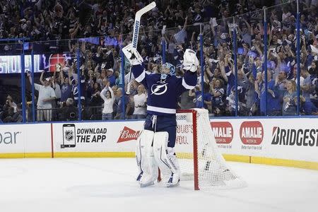 May 6, 2015; Tampa, FL, USA; Tampa Bay Lightning goalie Ben Bishop (30) reacts after center Tyler Johnson (9) scored a goal in the third period of game three of the second round of the 2015 Stanley Cup Playoffs at Amalie Arena. Tampa Bay Lightning defeated the Montreal Canadiens 2-1. Mandatory Credit: Kim Klement-USA TODAY Sports