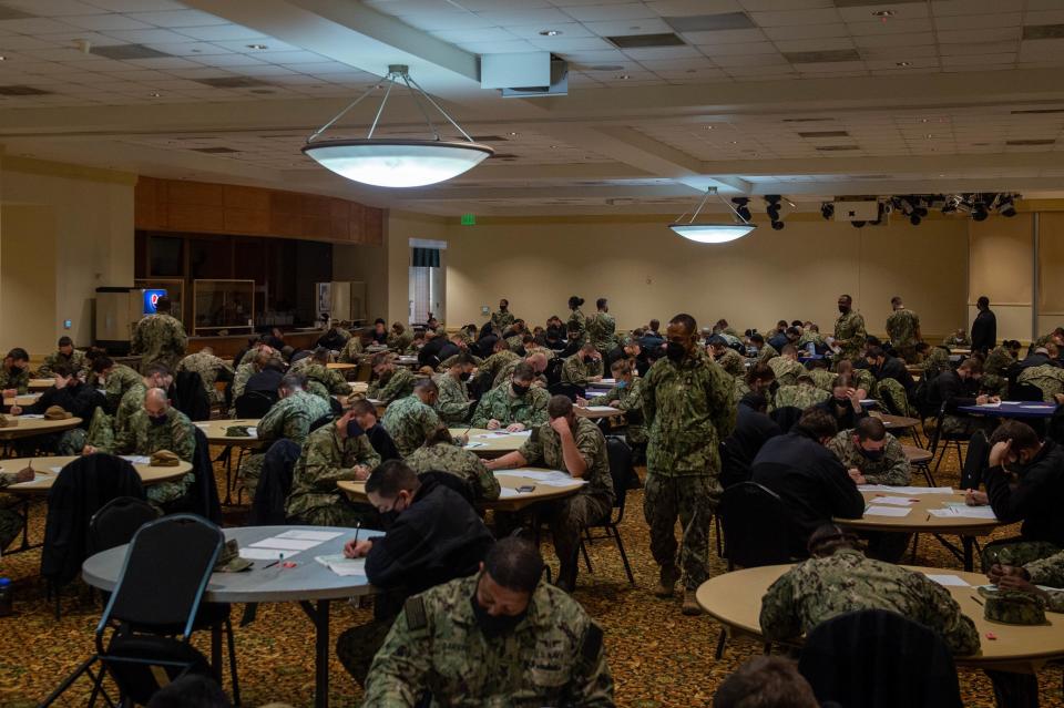 U.S. Navy sailors take the Chief Petty Officer exam at Vista Point on Norfolk Naval Base in Norfolk, Virginia, Jan. 20, 2022.