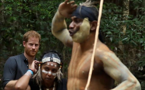 The Duke of Sussex watches a traditional dance by the Butchulla People - Credit: Kirsty Wigglesworth /AP